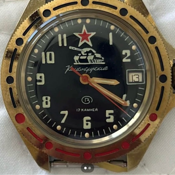 Vintage Gold and Black Watch with Red Accents